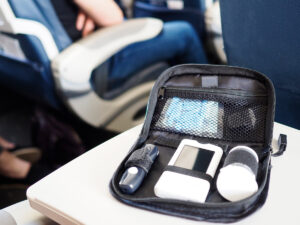 Glucose monitoring supplies on airplane